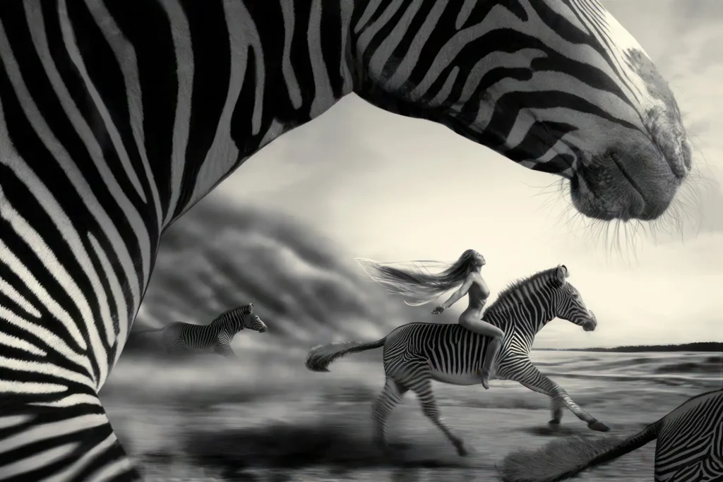 woman riding a zebra in front of a sand storm